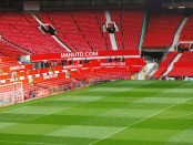 View of an empty pitch and stands at Old Trafford